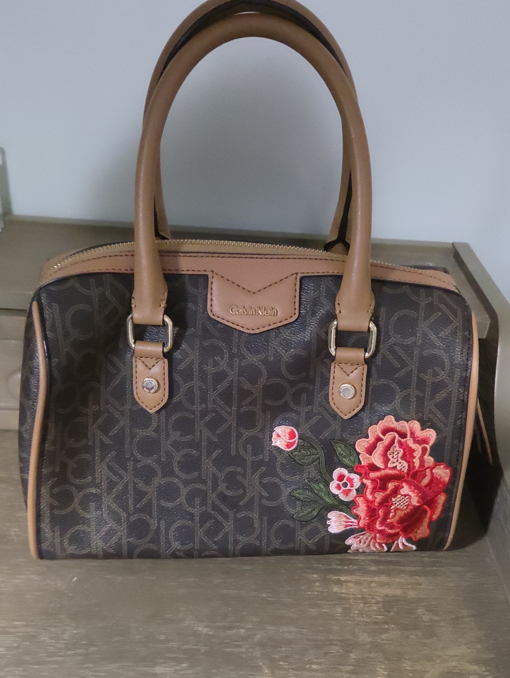 Calvin Klein Brown Monogram Satchel with Red Floral Applique: Gently Pre-owned.
